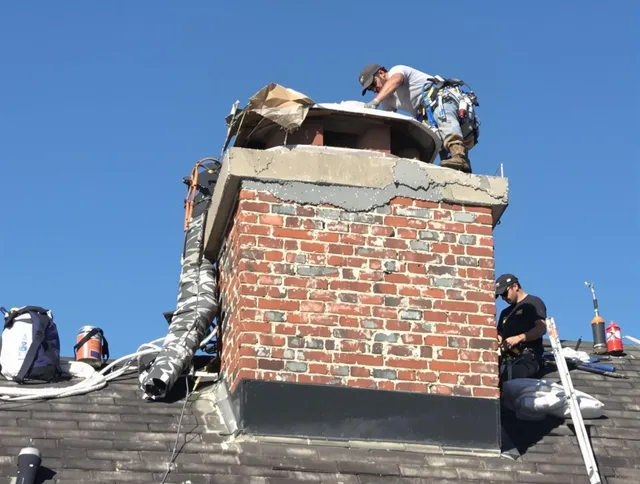 North Haven Chimney Sweep installing a custom chimney crown in North Haven, CT