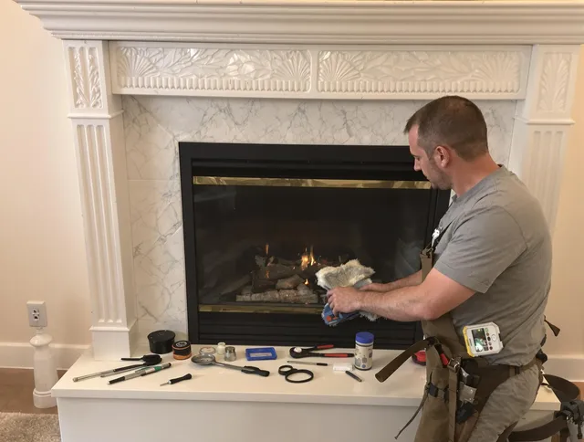North Haven Chimney Sweep performing fireplace maintenance in North Haven, CT