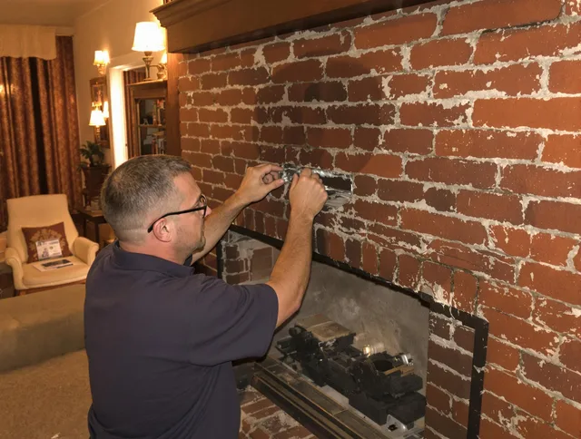 North Haven Chimney Sweep expert fixing a fireplace in North Haven, CT
